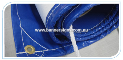 7m by .8m blue vinyl PVC banner finished with ropes and eyelets